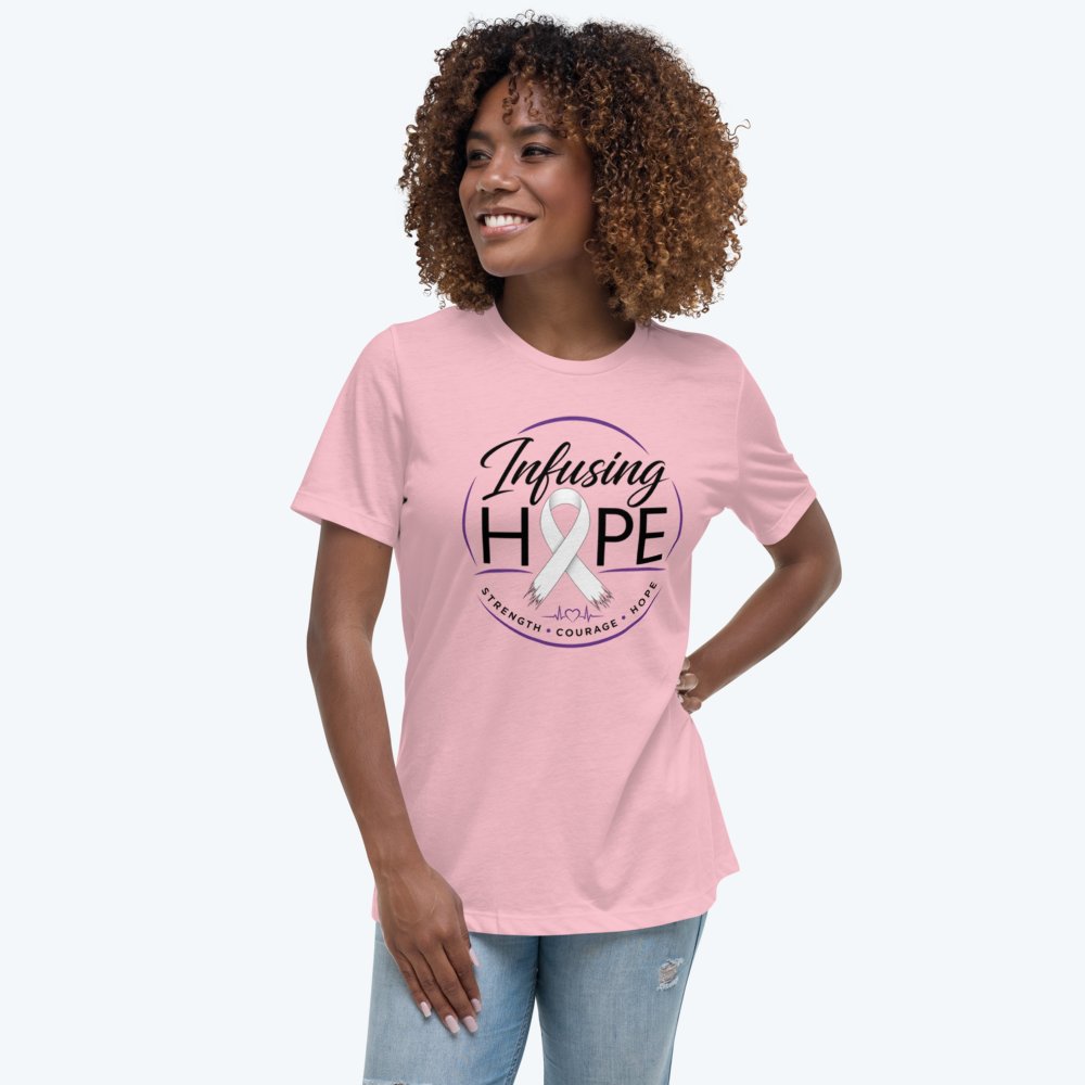 Smiling woman wearing the pink Infusing Hope women’s relaxed tee