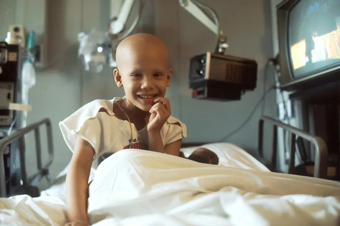 A child in a hospital room during childhood cancer care