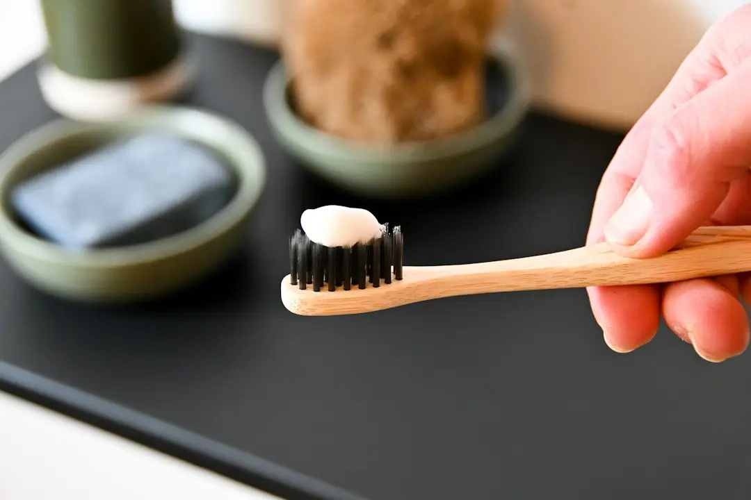 A toothbrush with toothpaste, ready for daily dental hygiene