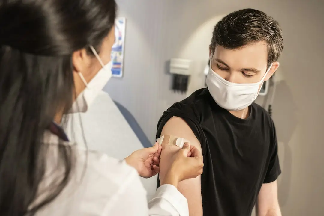 A woman getting a vaccine, part of staying current on vaccines for every age