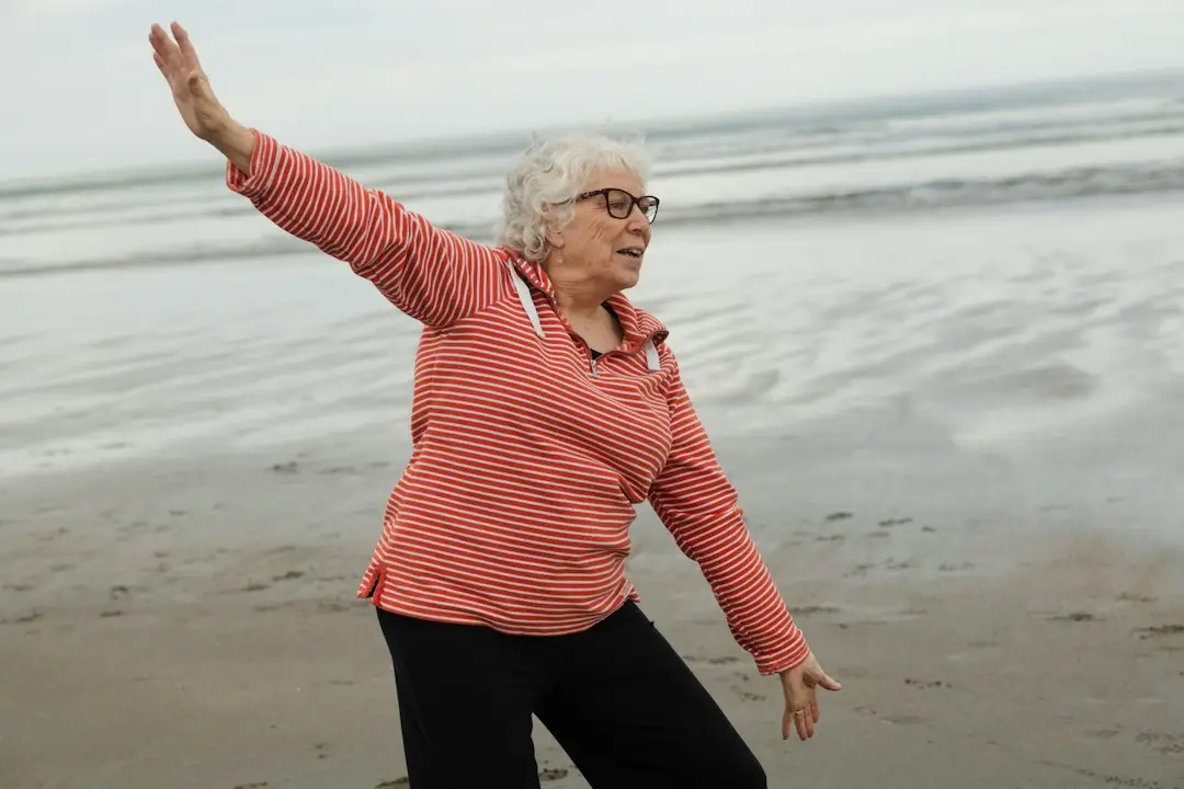 An older woman practicing tai chi for balance and falls prevention