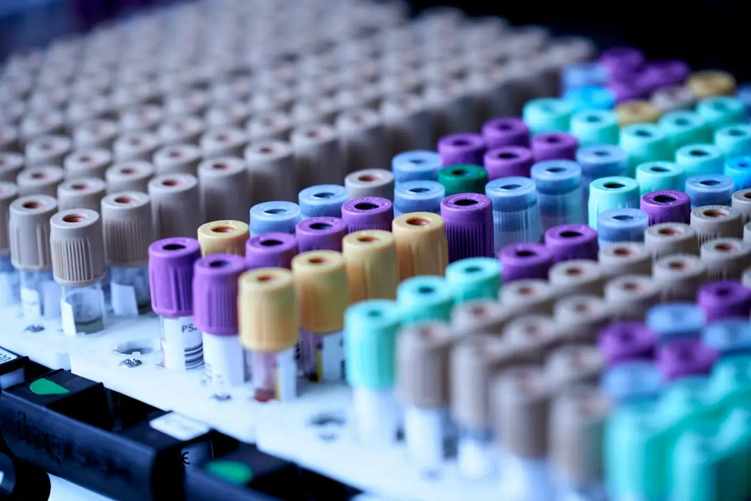 Blood collection tubes in a lab rack, like those used in blood cancer testing