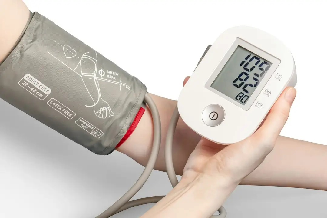Checking blood pressure with a home monitor for heart health