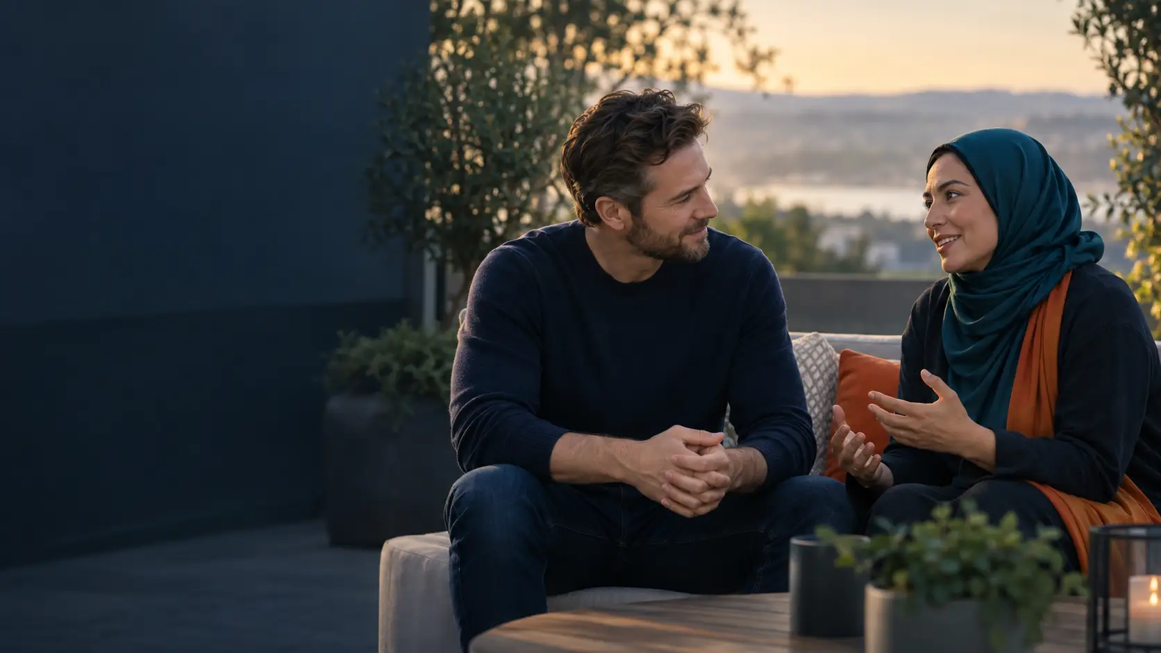 Two people having a supportive conversation about mental health care outdoors at dusk